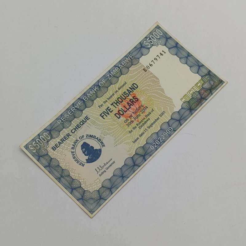 Zimbabwe $5000 Bearer cheque issued 15 Sept 2003 uncirculated with paper clip dent B number
