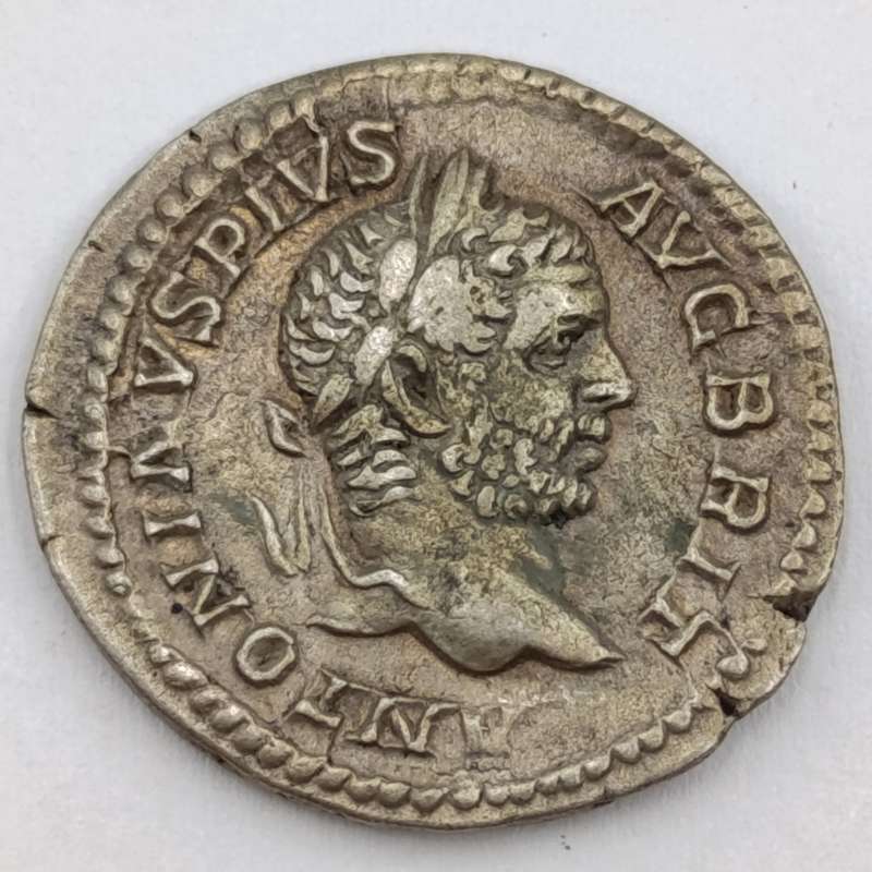Ancient Roman silver Denarius featuring Caracalla and Virtus - circa 206 AD