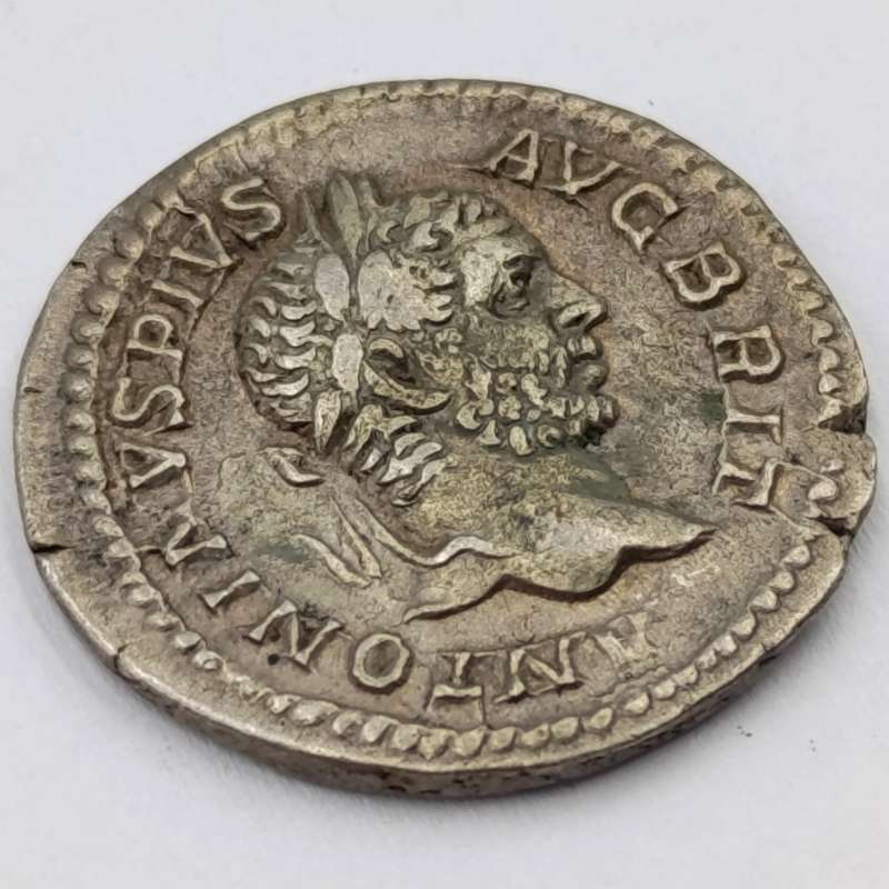 Ancient Roman silver Denarius featuring Caracalla and Virtus - circa 206 AD