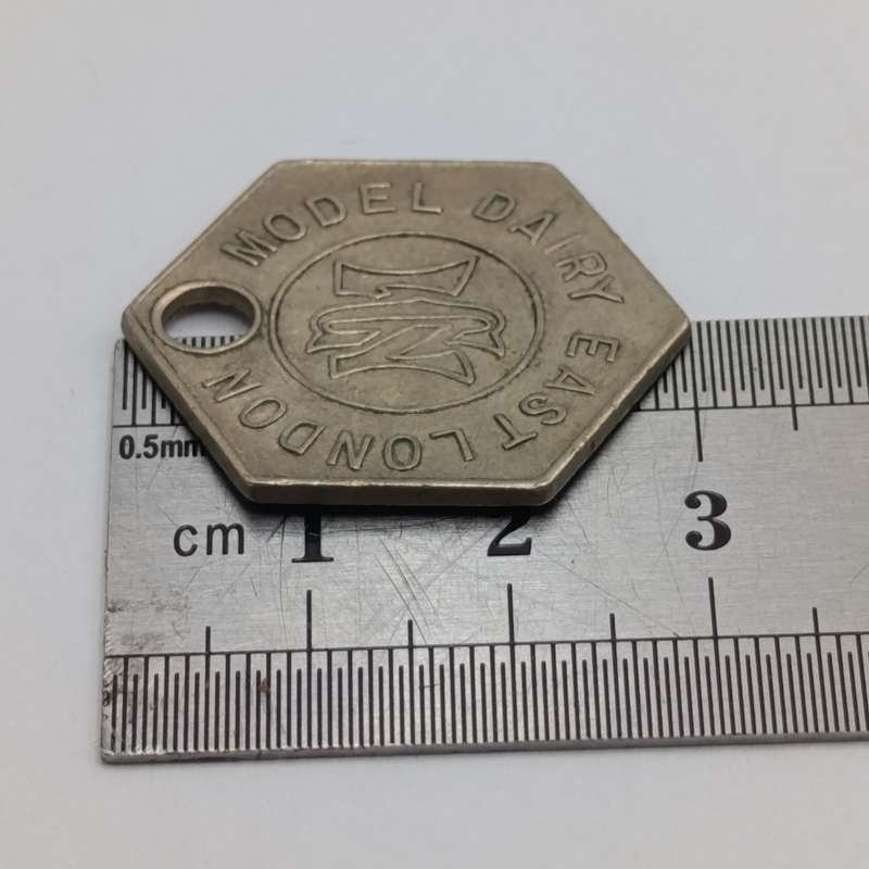 Model Dairy East London One pint hexagon milk token