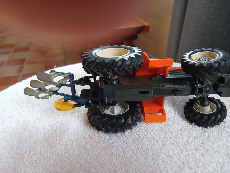 Britains 1985 Renault 145-14 tractor with Britains plough