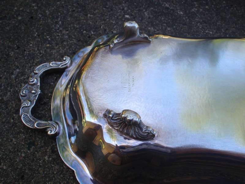 Gorgeous  silverplated tray, lovelt patterns, handles and feet. Wonderful for displaying items.