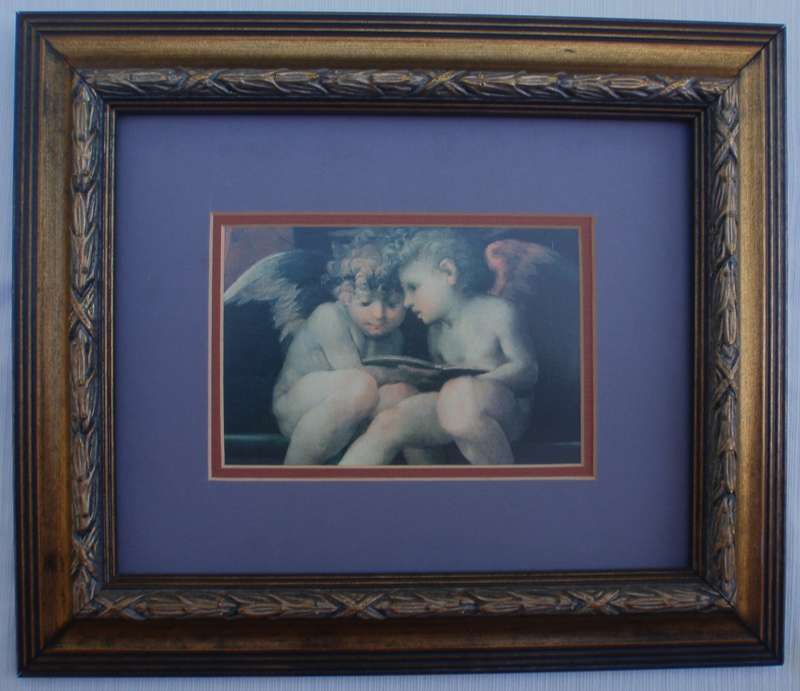 Charming pair of prints of famous artworks of Cherubs. Stunning ornate frames.