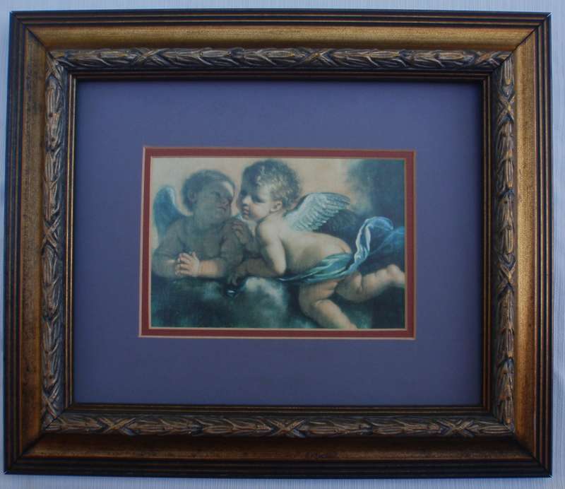 Charming pair of prints of famous artworks of Cherubs. Stunning ornate frames.