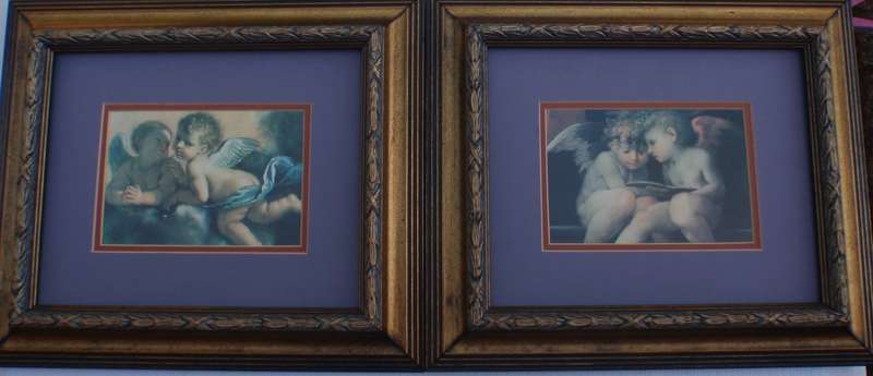 Charming pair of prints of famous artworks of Cherubs. Stunning ornate frames.
