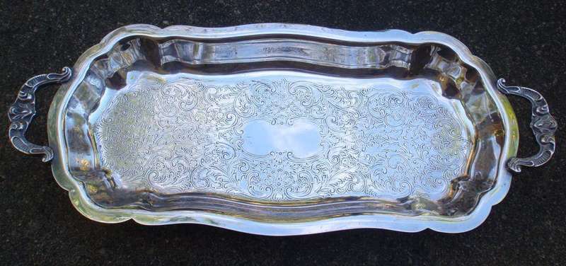 Gorgeous  silverplated tray, lovelt patterns, handles and feet. Wonderful for displaying items.