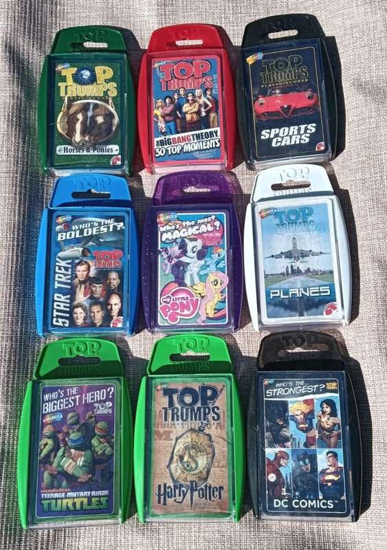 Large batch of 9 Top Trumps card sets in hard plastic casings