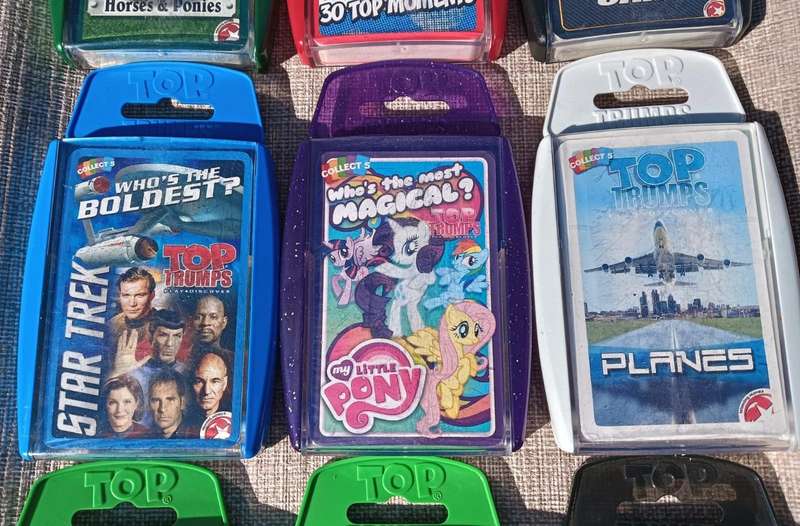 Large batch of 9 Top Trumps card sets in hard plastic casings
