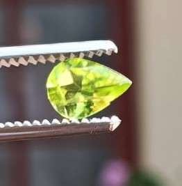 AROUND 40 YELLOW GREEN TITANITE / SPHENE GEMSTONES - VARIOUS CUTS AND SIZES - ONE BID FOR ALL!