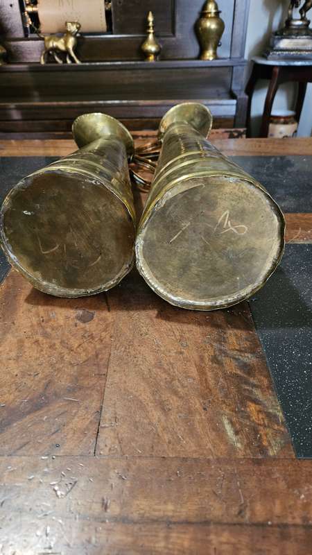 Two Tall Brass Pitchers