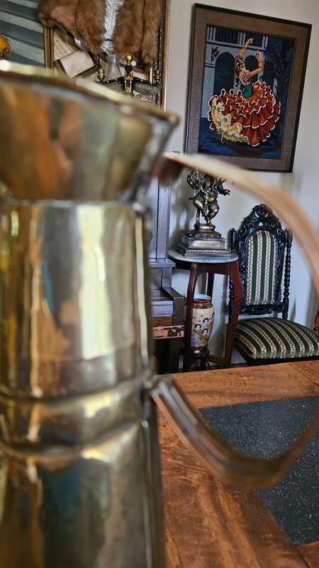 Two Tall Brass Pitchers