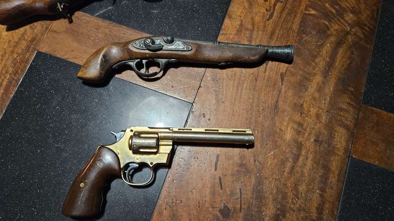 Vintage Flint Gun Replicas Plus a Lighter Gun