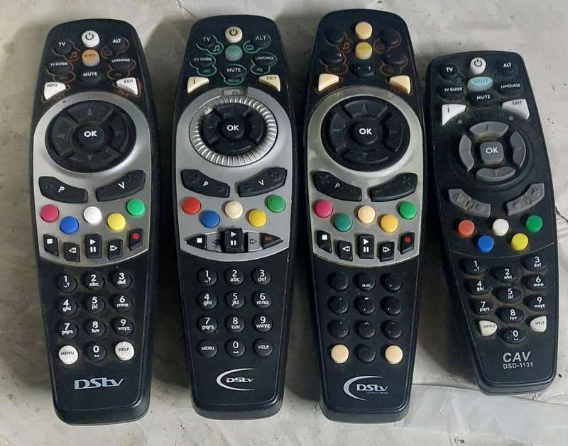 TESTED DSTV REMOTES X4 ALL WORKS BID FOR THE LOT 2 HAS BATTERY COVER AND 2 DOES NOT