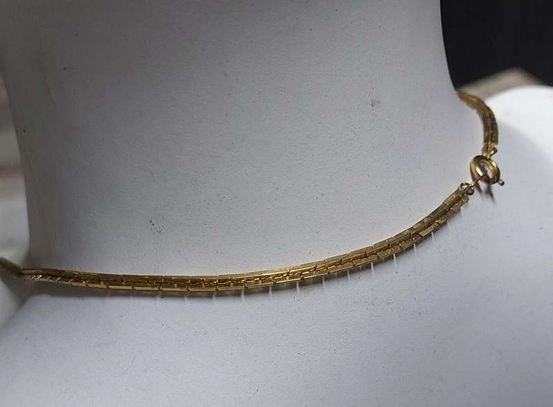 vintage neck chain absolutely stunning unsure of material nice weight.