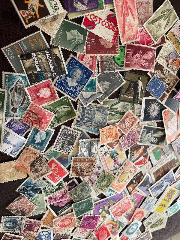 A COUPLE THOUSAND WORLD STAMPS OFF PAPER - 1
