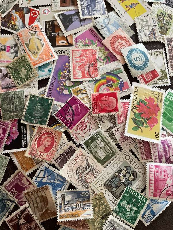 A COUPLE THOUSAND WORLD STAMPS OFF PAPER - 1