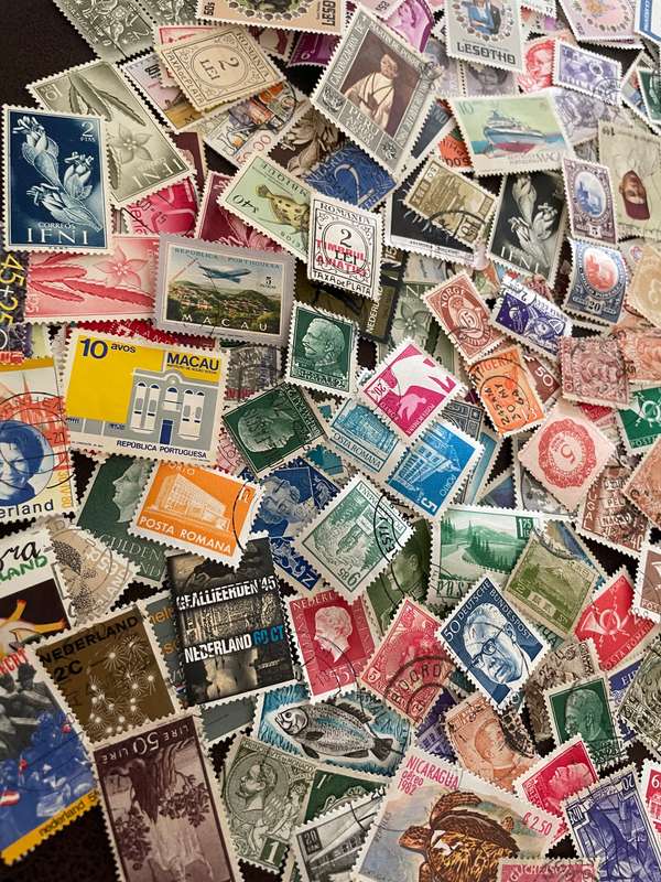 A COUPLE THOUSAND WORLD STAMPS OFF PAPER - 1