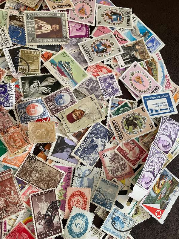 A COUPLE THOUSAND WORLD STAMPS OFF PAPER - 1