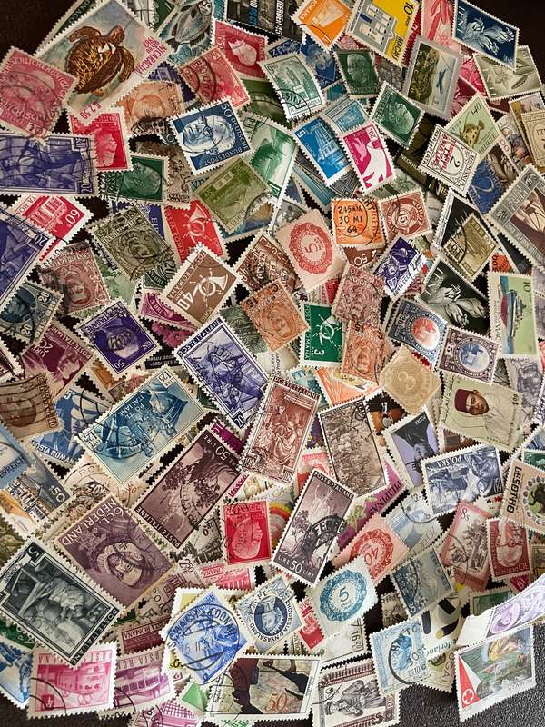 A COUPLE THOUSAND WORLD STAMPS OFF PAPER - 1