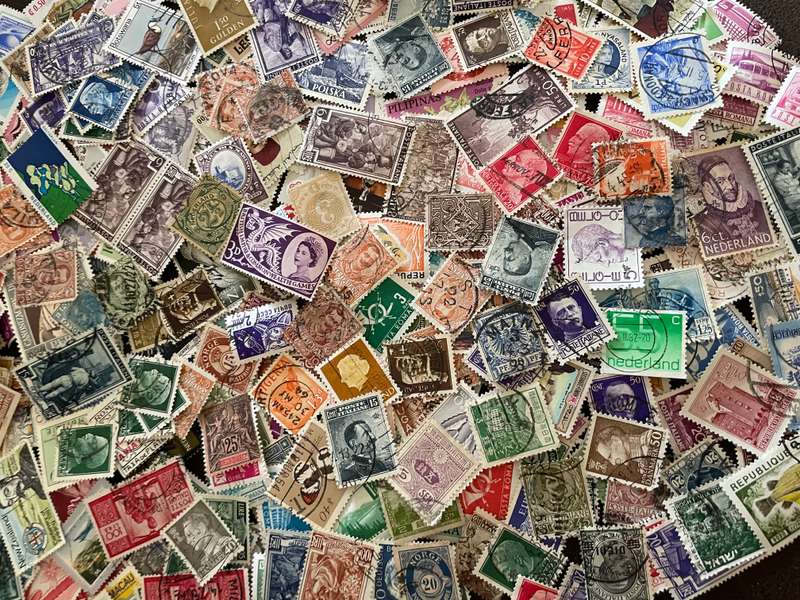 A COUPLE THOUSAND WORLD STAMPS OFF PAPER - 1