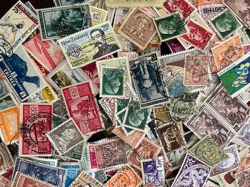 A COUPLE THOUSAND WORLD STAMPS OFF PAPER - 1