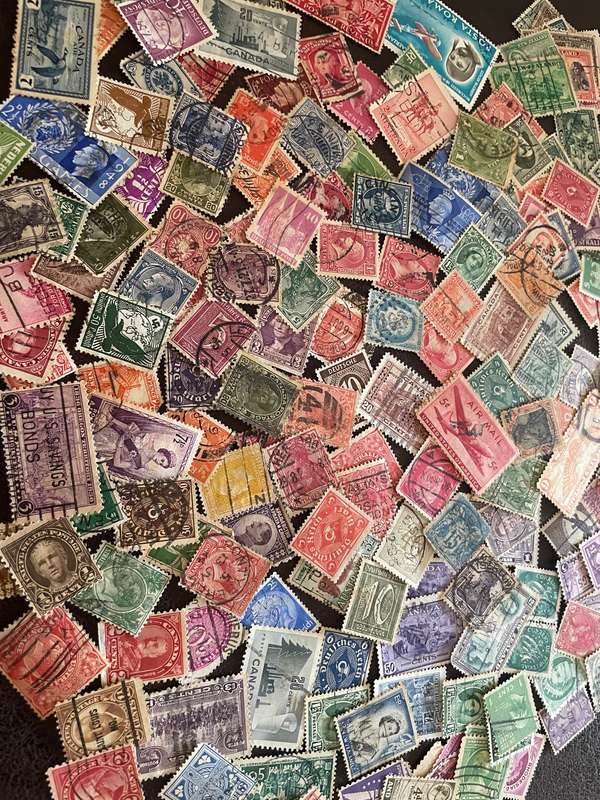 A COUPLE THOUSAND WORLD STAMPS OFF PAPER - 1