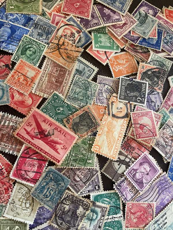 A COUPLE THOUSAND WORLD STAMPS OFF PAPER - 1