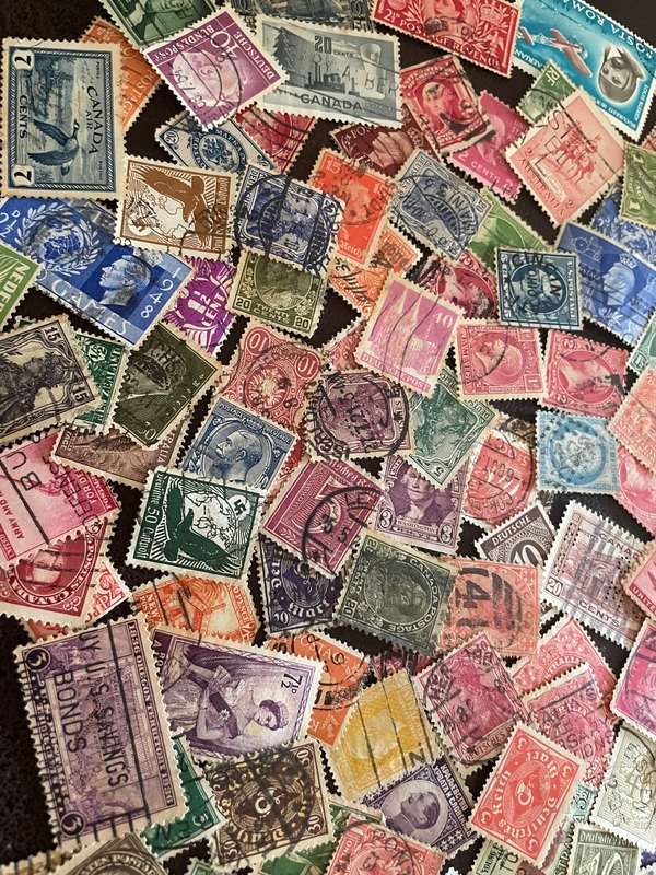 A COUPLE THOUSAND WORLD STAMPS OFF PAPER - 1