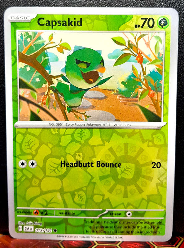 Pokemon Card - Capsakid 012/064 - Reverse Holofoil - Surging Sparks  NM