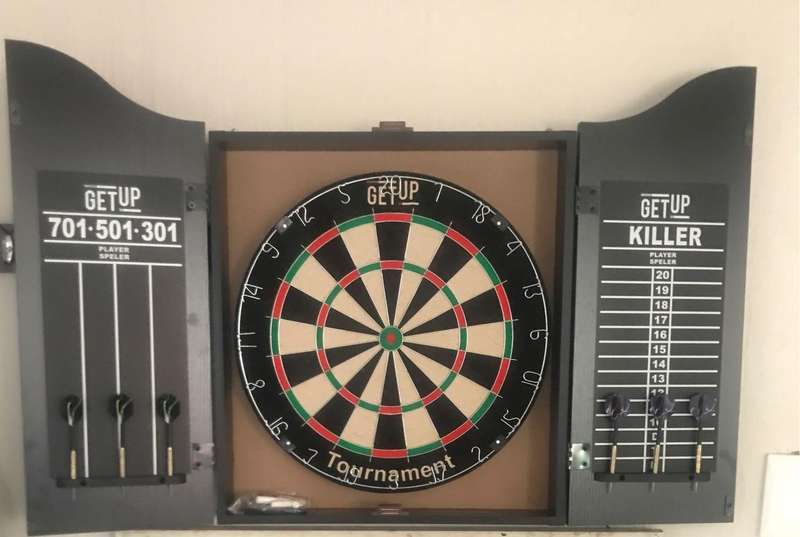 Dartboard in cabinet