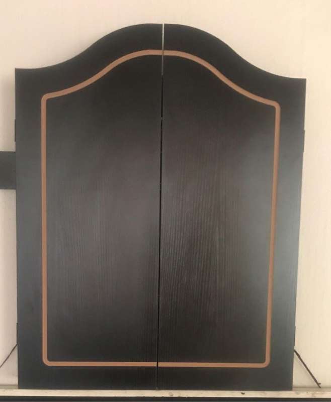 Dartboard in cabinet
