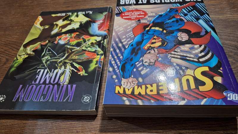 2x DC books Kingdom Come and Superman our worlds at war