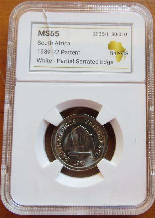 1989 R2 Pattern Coin MS65 SANGS Graded Partial Serrated Edge-Cracked Slab