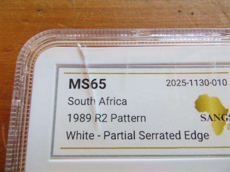 1989 R2 Pattern Coin MS65 SANGS Graded Partial Serrated Edge-Cracked Slab