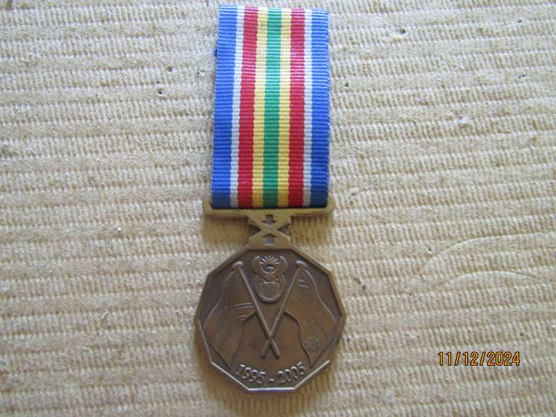 Full size Police 10 Years Commemoration  Service Medals.