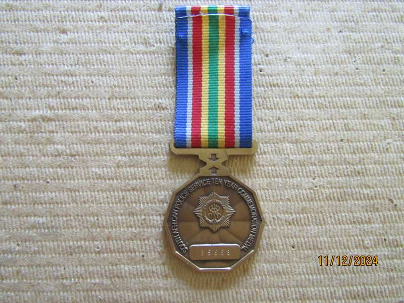Full size Police 10 Years Commemoration  Service Medals.