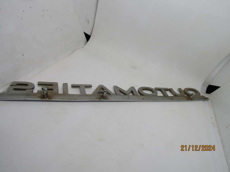 Vintage Ford Fairlane Outomaties Metal Sign. Pins intact. 27CM