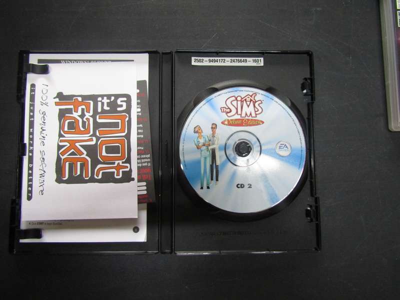 EA Games PC Game  Booklet. Then Simms Deluxe Edition disk 2 . Disk no scratches.
