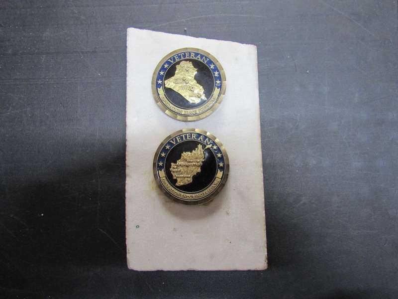 Afghanistan Veteran Challenge Coin on Supposedly Sadam Huseins floor tiles. NOCA