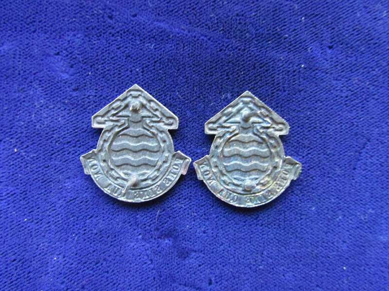 Pair of Army Logistic Ordinance Collar Badges. Pins intact.