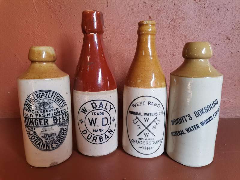 Four antique ginger beer bottles