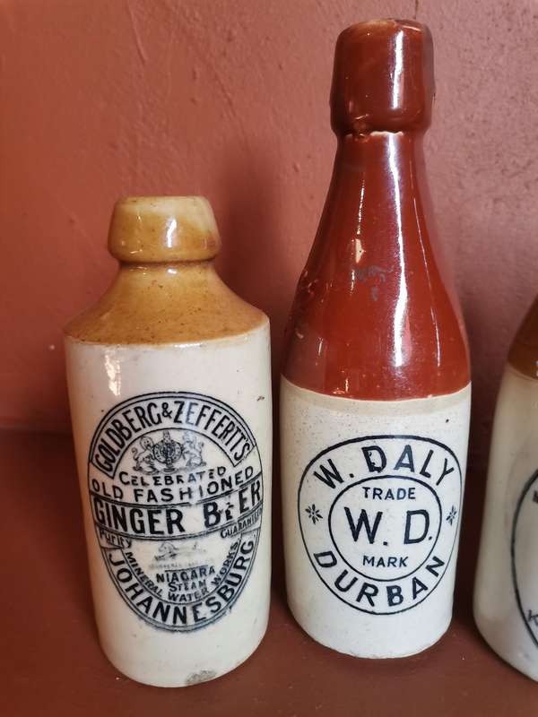 Four antique ginger beer bottles