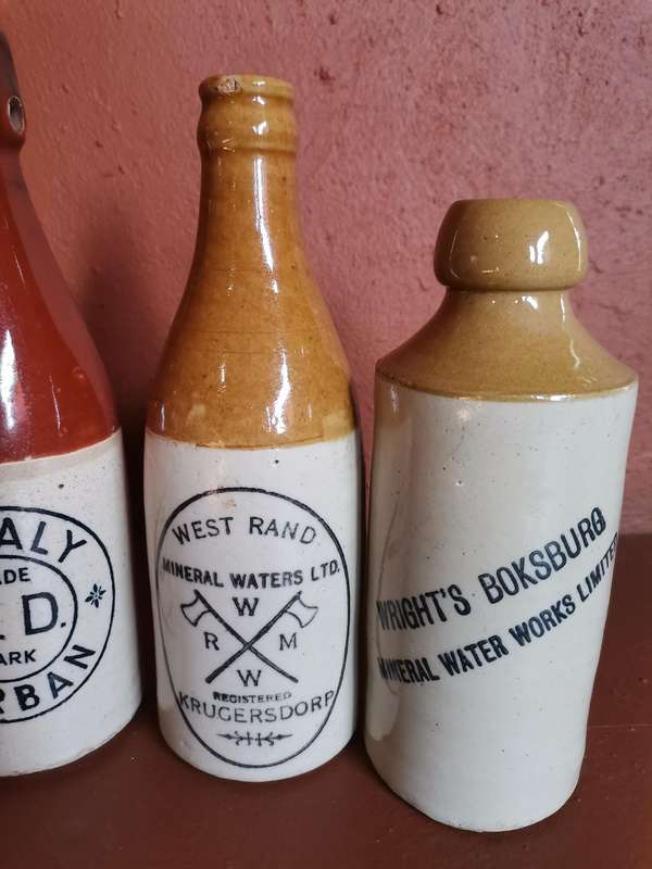 Four antique ginger beer bottles