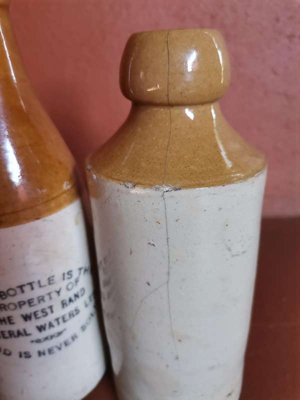 Four antique ginger beer bottles