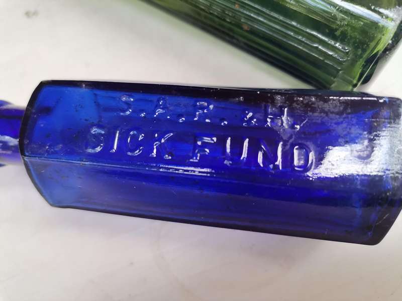 Two antique bottles SAR & H