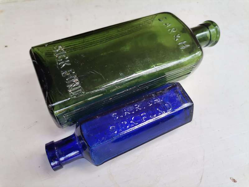 Two antique bottles SAR & H