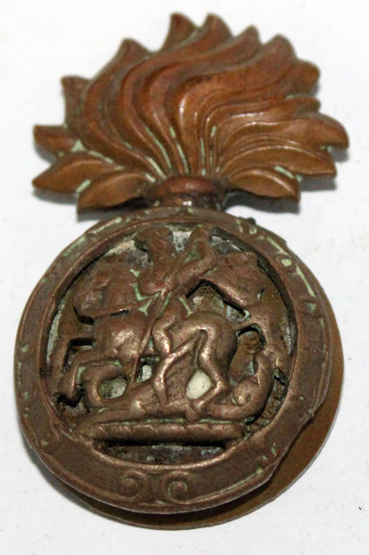 Northumberland Fusiliers cap badge (damaged)