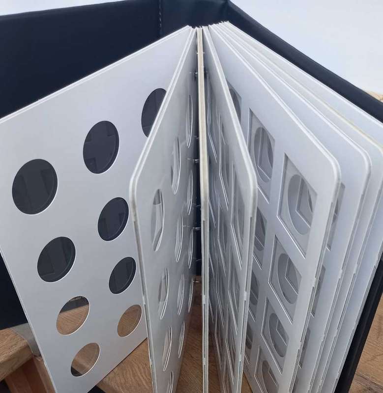 8 PAGE COIN FLIP FILE IN GOOD CONDITION. STORES 96 COINFLIPS.