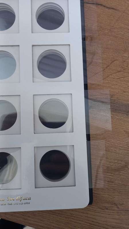 8 PAGE COIN FLIP FILE IN GOOD CONDITION. STORES 96 COINFLIPS.