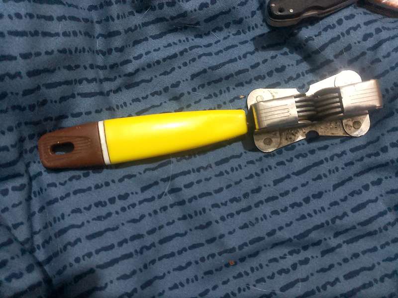THREE FOLDING KNIVES AND ONE VINTAGE SHARPENER